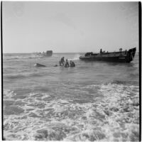 Military personnel practice a water rescue during the Army-Navy maneuvers that took place off the coast of Southern California in late 1946