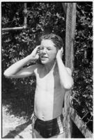 Boy takes part in a free summer camp organized by Los Angeles Sheriff Eugene Biscailuz. Circa July 1937