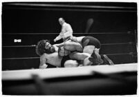 Wrestlers "Daniel Boone" Savage and Hans Steinke battle it out at the Grand Olympic Stadium. June 16, 1937