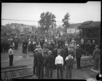 Crowds wait for the appearance of President Franklin D. Roosevelt from his train at Central Station, October 1, 1935