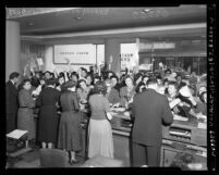 Western Union telegram office filled with League of Women Voters sending telegrams opposing Bricker Amendment, Los Angeles, 1954