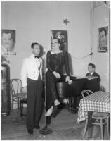 Female impersonator seated on piano in Los Angeles club, circa 1937