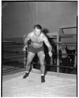 Heavyweight wrestling champion Bronko Nagurski prepares to take on challenger Vincent López, Los Angeles, 1937
