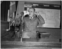 Dr. George K. Dazey on the witness stand at the trial where he is accused of the murder of his second wife, Doris S. Dazey, Los Angeles, 1939-1940