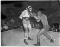 Ceferino Garcia, champion boxer from the Philippines, landing a punch, Los Angeles, circa 1938