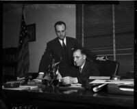 District Attorney Buron Fitts and John Klein, announcing the creation of a "gang squad" designed to rid Los Angeles of gangsters and racketeers, Los Angeles, November 17, 1937