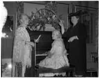 Mrs. A.J. Woodward plays the piano while Mrs. James A. Beck and Mrs. Yvonne Chrarton stand nearby, Los Angeles