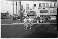 Two drive-in restaurant waitresses leaving work, Los Angeles, 1937