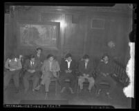 Seven Latino men, arrested in zoot suit clash, seated in Los Angeles, Calif. courtroom in 1943