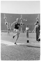 USC track athlete about to jump during a meet, Los Angeles, 1937