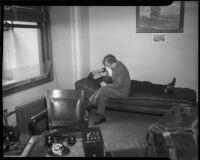 Louis Rude Payne lies on couch, with father Lucius Payne at his side ...