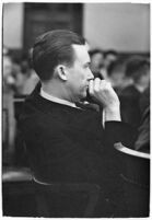 Widower Robert S. James sitting in a courtroom during an inquest involving his wife's death, Los Angeles, 1935