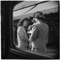 Woman talks to truant girls in downtown Los Angeles, March 1946