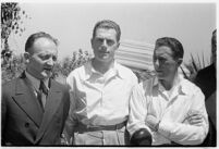 Russian aviators meet the press after breaking the non-stop flight record, flying from Moscow to San Jacinto, CA. July 14, 1937