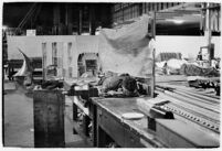 Man sleeping at the Douglas Aircraft Corporation plant where workers participated in a sit-down strike, Santa Monica, 1937