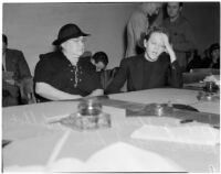 Deputy Sheriff Mary Talbot sits with Betty Flay Hardaker who was convicted of murdering her daughter, Los Angeles, 1940