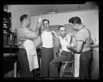 Two veterans being fitted for prosthetic limbs at UCLA's National Research Council Committee on Artificial Limbs