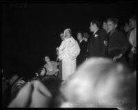 Popular evangelist Aimee Semple McPherson sings to a crowd