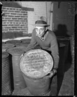 Unknown man with unknown container in WPA warehouse , circa 1936