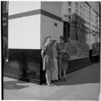 Woman speaks to truant children in downtown Los Angeles, March 1946