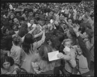 Leo Carrillo surrounded by fans