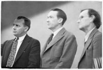 Murder suspect Robert S. James standing between two unidentified men in court, Los Angeles, 1936