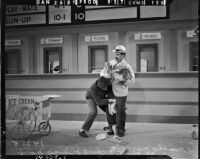 Julius "Groucho Marx and Leonard "Chico" Marx performing during filming for "A Day at the Races," Los Angeles, 1937