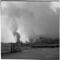 Smoke rises over L.A. Harbor from the fires that began when the Markay oil tanker exploded, Los Angeles, 1947