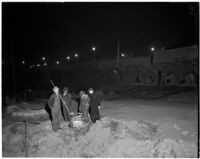 Men working at night to repair damage from the Elysian Park landslide, Los Angeles, November 1937