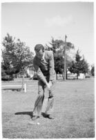 Golfer Fay Coleman demonstrates a series of "right" and "wrong" golf swings