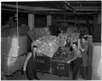 Employees at The May Co. prepare merchandise for downtown Dollar Day, Los Angeles, 1940