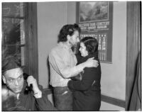 Cowboy film extra Jerome "Blackjack" Ward with his wife Mickey during a re-enactment of his confrontation with fellow extra Johnny Tyke, Los Angeles, February 24, 1940