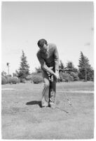 Golfer Fay Coleman demonstrates a series of "right" and "wrong" golf swings