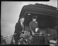 Eleanor Roosevelt greets crowd as she arrives by train, Los Angeles, 1935