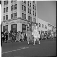 Pair dressed as Raggedy-Ann and Andy marching in the post-war Labor Day parade, Los Angeles, 1946