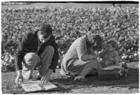 Spectators take a break on opening day of Santa Anita's fourth horse racing season, Arcadia, December 25, 1937