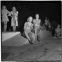 Models wear "sea-serpent scroll" patterned swim suits designed by Margit Fellegi during a fashion show, Los Angeles, September 1946