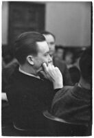 Widower Robert S. James sitting in a courtroom during an inquest involving his wife's death, Los Angeles, 1935