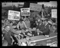 Supporters surrounding U.S. presidential candidate Adlai Ewing Stevenson, riding in automobile during campaign in Los Angeles, Calif., 1952