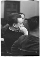 Widower Robert S. James sitting in a courtroom during an inquest involving his wife's death, Los Angeles, 1935