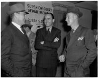 Loyola Marymount head football coach Tom Lieb with team member Walter Christensen and attorney Charles Gass, Los Angeles