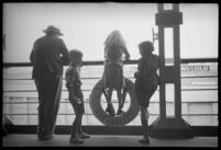 Passengers on the deck of the S.S. Mariposa looking out into the distance, Los Angeles