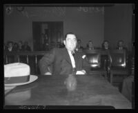 William Bioff sitting at defendant's table during court proceedings, Los Angeles, 1939