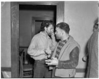 Cowboy film extras Jerome "Blackjack" Ward and Yukon Jake re-enacting Blackjack's confrontation with fellow extra Johnny Tyke in Gower Gulch, Los Angeles, February 24, 1940