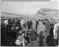 Vittorio Mussolini arrives at Union Air Terminal from Rome and is greeted by his host, producer Hal Roach, and the press, Los Angeles, September 25, 1937