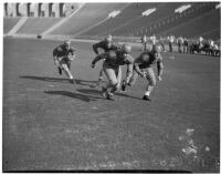 Washington Huskies practice before a game at the Coliseum, Los Angeles, 1936