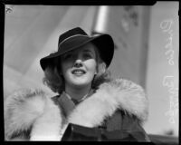 Actress Phyllis Brooks wearing a fur-lined coat and fedora, Los Angeles, 1937