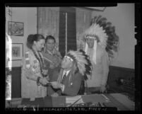 Prince Tha Tha Quha, Tom Youngplant and Chief Sunrise with Board of Supervisor Raymond V. Darby in headdress Los Angeles, Calif., circa 1947