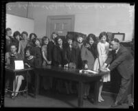 Women clerical employees of Los Angeles Police Department getting fingerprinted and photographed in 1928