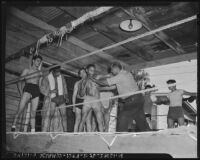 Boxing coach advises his athletes at an outdoor gymnasium, Los Angeles, 1942